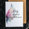 Printable condolence card featuring angel wings, expressing deepest sympathy and support during a difficult time.