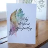 Printable condolence card featuring angel wings, expressing deepest sympathy and support during a difficult time.