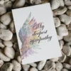 Printable condolence card featuring angel wings, expressing deepest sympathy and support during a difficult time.