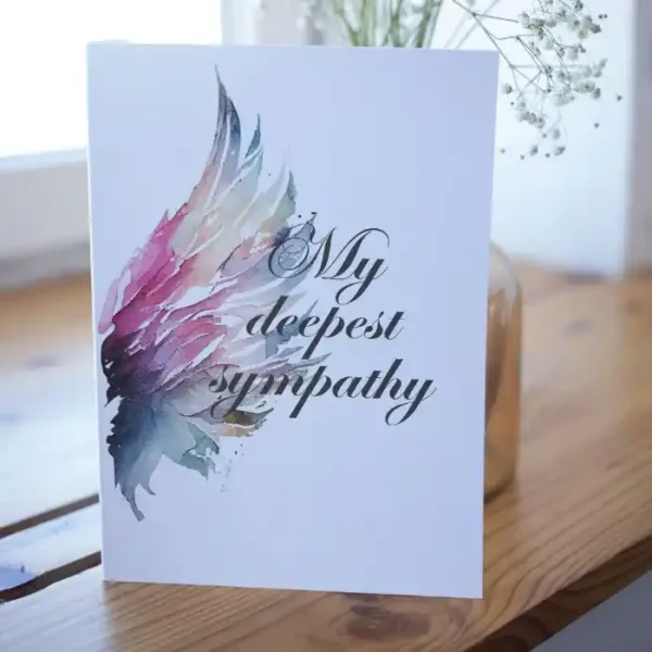 Printable condolence card featuring angel wings, expressing deepest sympathy and support during a difficult time.