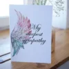 Printable condolence card featuring angel wings, expressing deepest sympathy and support during a difficult time.