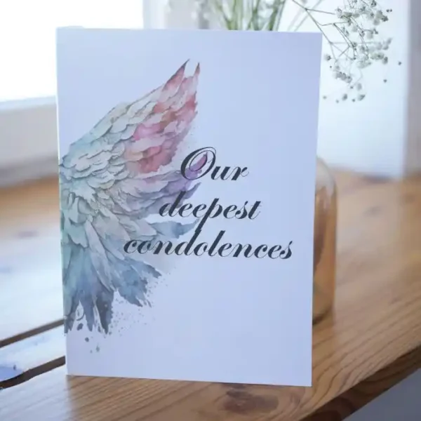 Printable condolence card featuring angel wings, expressing deepest sympathy and support during a difficult time.