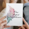 Printable condolence card featuring angel wings, expressing deepest sympathy and support during a difficult time.