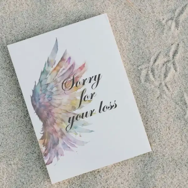 Printable condolence card featuring angel wings, expressing deepest sympathy and support during a difficult time.