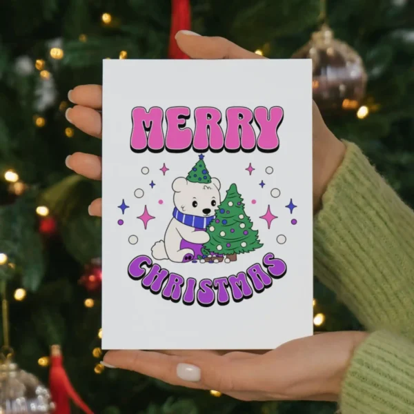 A bisexual holiday card displaying a friendly polar bear next to a beautifully adorned Christmas tree, ideal for festive greetings.