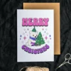 A printable bisexual Christmas card with a cute polar bear and a vibrant Christmas tree, spreading holiday cheer.