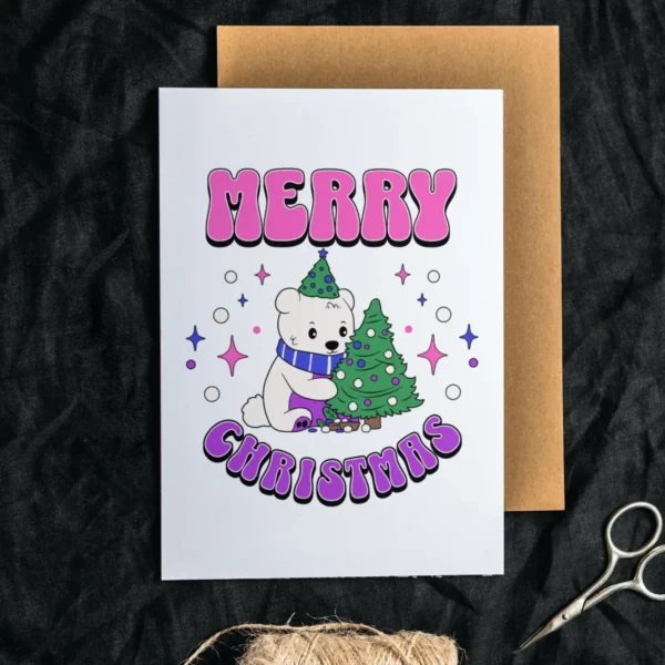 A printable bisexual Christmas card with a cute polar bear and a vibrant Christmas tree, spreading holiday cheer.