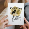 Cheerful Capricorn birthday card highlighting traits, designed with a yellow watercolor background symbolizing earth.