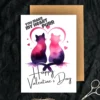 Two watercolor cats in pink and purple sit close together, forming a heart shape with their silhouettes. Text reads "You Make My Heart Purr" and "Happy Valentine's Day".