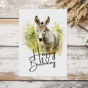 Watercolor illustration of a cheerful donkey with a birthday hat, perfect for a printable birthday card.