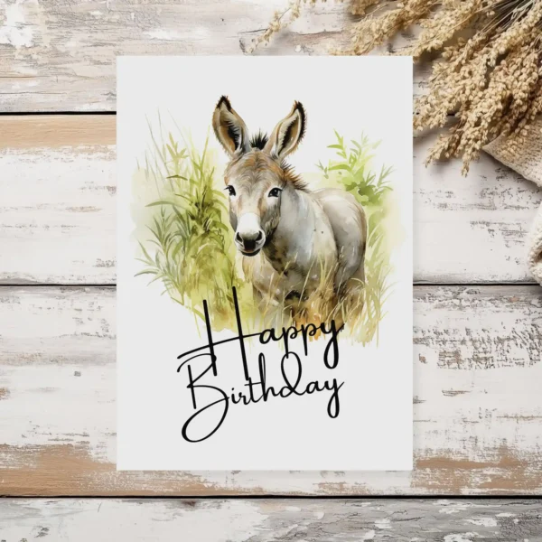 Watercolor illustration of a cheerful donkey with a birthday hat, perfect for a printable birthday card.