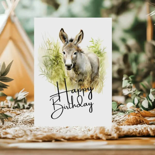 Cute printable donkey birthday card with watercolor drawing in natural setting.