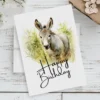 Happy birthday donkey watercolor art featuring a joyful donkey and a festive "Happy Birthday" greeting for a card.