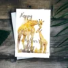 Sweet watercolor artwork of a giraffe and her calf, designed for a Mother's Day card, showcasing love and tenderness.