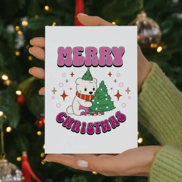Printable lesbian Christmas card with a polar bear in a festive hat and a bright Christmas tree, ideal for sharing love this season.