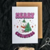 Joyful lesbian Christmas card depicting a polar bear in a hat alongside a Christmas tree, celebrating the warmth of the holidays.
