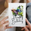 Multi-color watercolor birthday card showcasing a joyful butterfly, ideal for sending warm wishes on a special day.