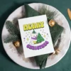 A printable Christmas card featuring a polar bear in a rainbow scarf, celebrating nonbinary pride amidst a winter scene.