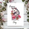 Sweet watercolor design of a mother opossum and her babies, ideal for a heartfelt Mother's Day card.