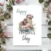 Heartwarming illustration of an otter mother and her baby on a printable Mother's Day card, celebrating their bond.