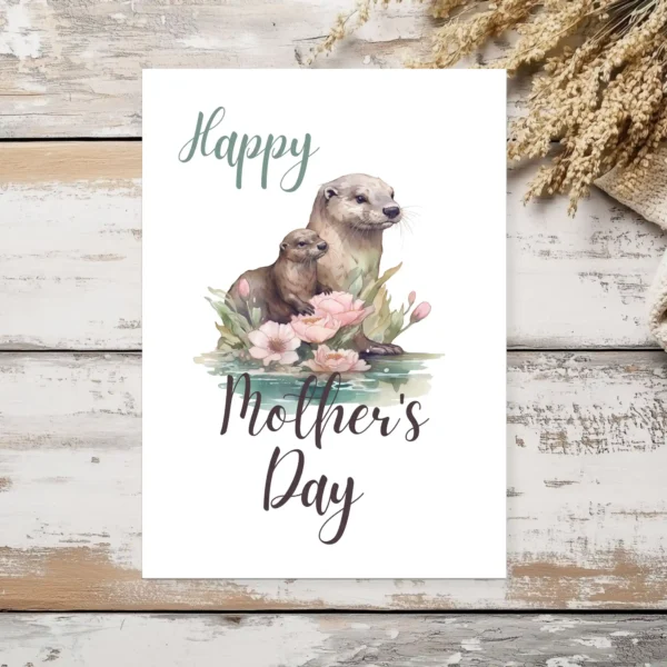 Sweet otter mom and baby depicted on a printable Mother's Day card, capturing the essence of maternal love and joy.