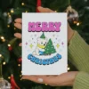 A festive card featuring a cartoon bear and a colorful Christmas tree, celebrating pansexual pride.