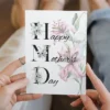 Happy Mother's Day card featuring vibrant lilies and a cheerful message, perfect for celebrating moms.