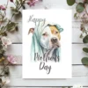 Charming watercolor image of a Pitbull under a blanket, made for a Mother's Day greeting card.