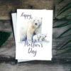 Happy Mother's Day card showcasing a watercolor polar bear mom with her playful cubs in a joyful scene.