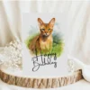 Watercolor birthday card featuring an Abyssinian cat in a natural setting with a cheerful "Happy Birthday" message.