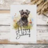 Watercolor birthday card featuring a happy Affenpinscher in a natural setting with a cheerful "Happy Birthday" message.