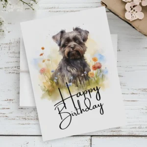 Printable birthday card with a joyful Affenpinscher in a watercolor style, set in nature, saying "Happy Birthday."