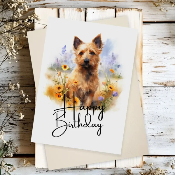 Watercolor birthday card featuring an Australian Terrier in a natural setting with a cheerful "Happy Birthday" message.