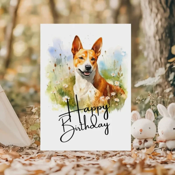 Printable Basenji dog birthday card in watercolor style, set in nature, featuring a vibrant "Happy Birthday" message.