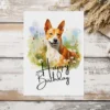Happy birthday card with a watercolor Basenji dog in a natural scene, including a festive "Happy Birthday" note.