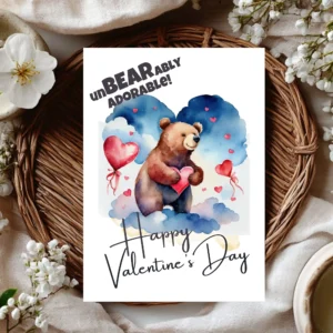 Printable Valentine's Day card featuring a brown bear holding a heart, surrounded by red balloons against a blue sky.