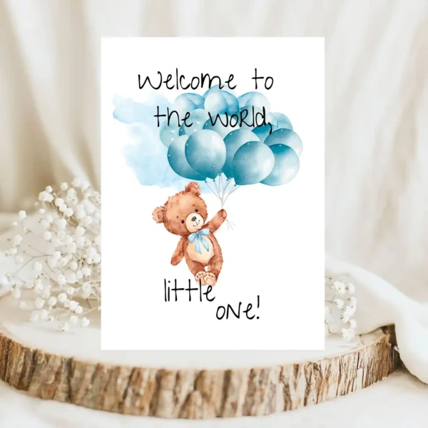 Adorable watercolor card with a teddy bear and blue balloons, greeting a new baby with "Welcome to the world, little one!"