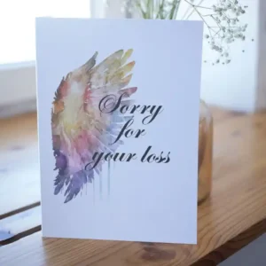 Printable condolence card featuring angel wings, expressing deepest sympathy and support during a difficult time.