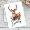 Charming deer birthday card showcasing a watercolor design with the phrase "Happy Birthday" prominently displayed.