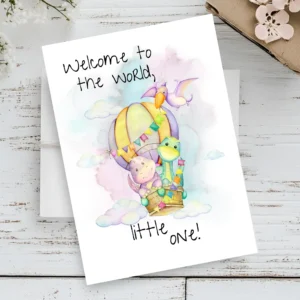 A pastel watercolor greeting card featuring a cartoon bird and balloon with the message, "Welcome to the world, little one!"