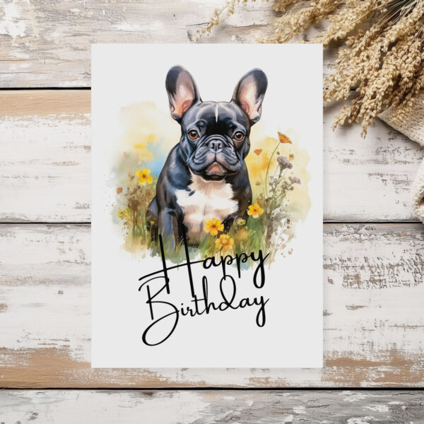 Happy birthday card showcasing a French bulldog in a watercolor style, surrounded by nature, with a "Happy Birthday" greeting.
