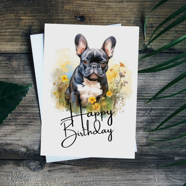 Printable birthday card with a joyful French bulldog watercolor illustration, set in nature, saying "Happy Birthday."