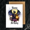 Birthday card with a purple gothic dragon holding a lantern, adorned with vibrant flowers for a whimsical touch.