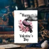 Cheerful Gothic Valentine's Day card featuring a raven and pink roses, perfect for celebrating love.