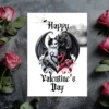 Gothic Valentine's Day card with a winged black and white cat duo forming a heart shape, surrounded by red and black swirls and skulls. Pink roses flank the card.