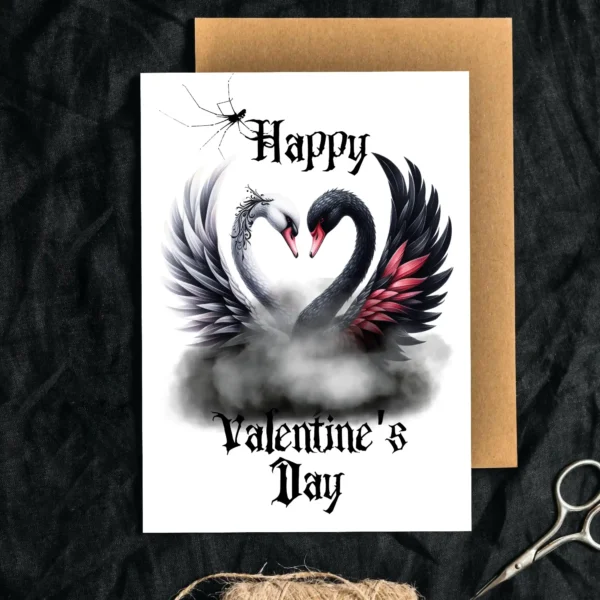 A Gothic Valentine's card featuring a white and black swan, their necks forming a heart.