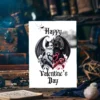 Two cats with bat wings form a heart shape, one black and one white, surrounded by skulls and ornate designs. Text reads "Happy Valentine's Day."