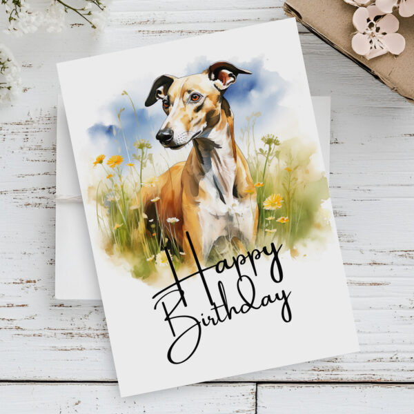 Happy birthday card with a greyhound illustration in a natural setting, designed in watercolor with a festive message.