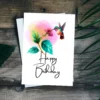 Sweet hummingbird birthday card, featuring a bird sipping from a flower in a vibrant watercolor illustration.