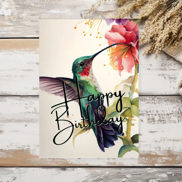 Delightful printable birthday card featuring a green hummingbird and floral accents, designed in watercolor.